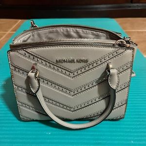 Michael Kors Grey medium handbag used with some discoloration and wear